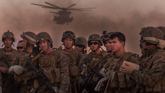 Marine Infantry Officer Course students await a CH-53E Super Stallion helicopter fast rope drill on the Marine Corps Air Station Yuma, Ariz., Auxiliary Landing Field 2, Wednesday, August 18, 2014. The fast rope training instilled in these Marines the skills necessary to complete IOC’s final exercise, Talon Reach IV.