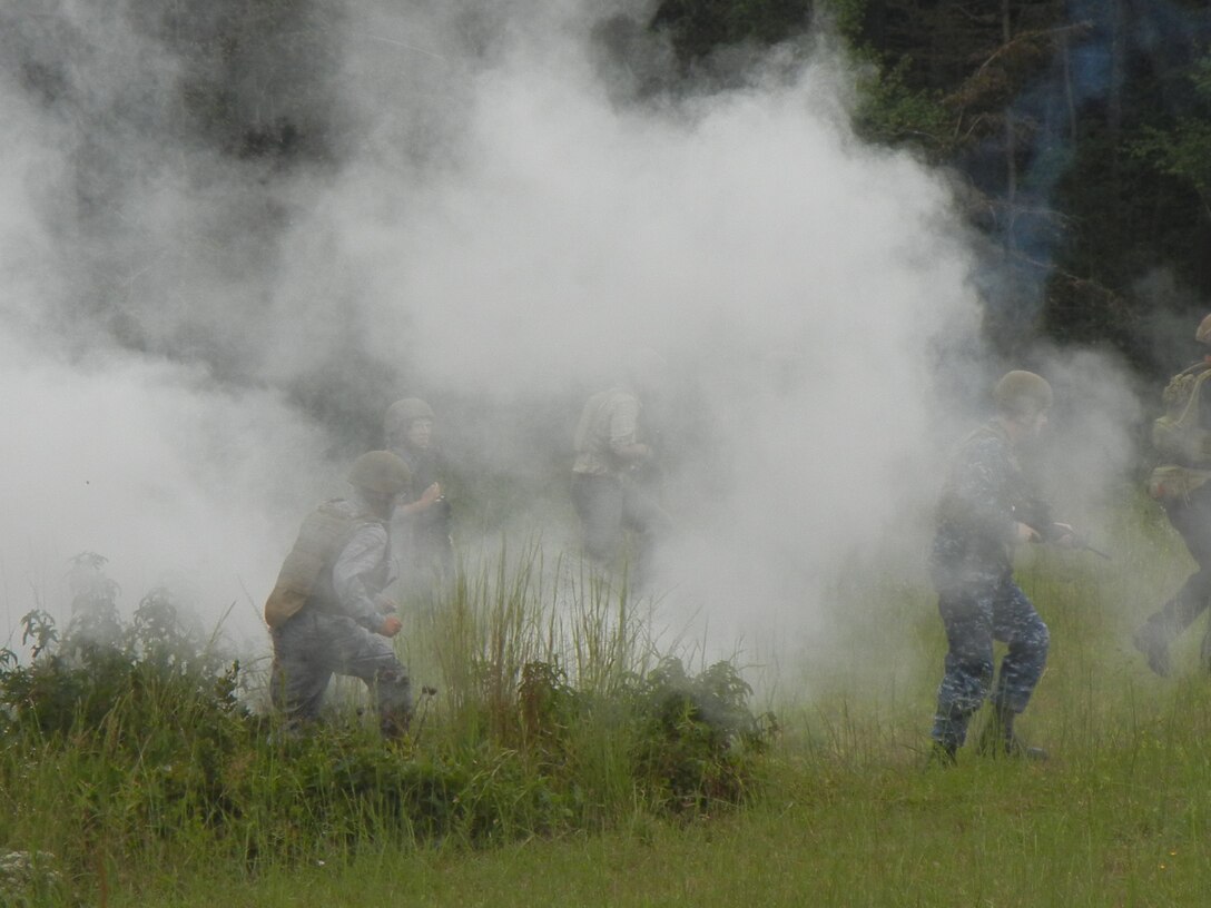 Senior military and civilian leaders undergo a simulated combat patrol at Weapons Range 14 as part of their ECHO training at Marine Corps Base Quantico on Sept. 10. The attendees were under the watchful eyes of Special Forces operators.
