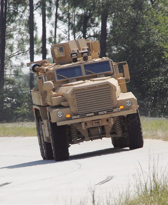 A Category II A1 Cougar Mine-Resistant, Ambush-Protected vehicle runs laps around Marine Depot Maintenance Command/Production Plant Albany’s test track recently performing final operational testing before being sent to the warfighter.
