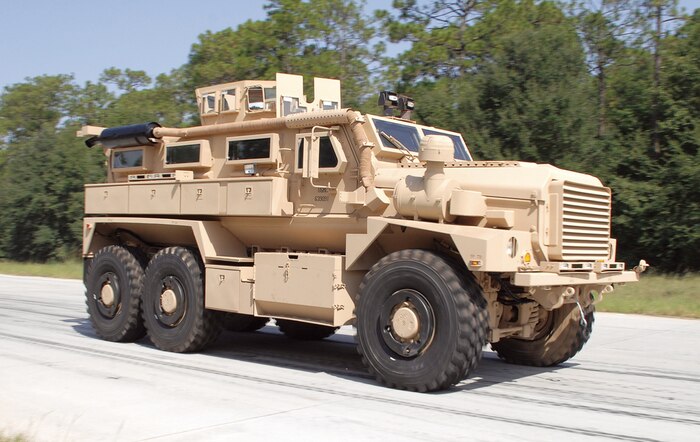 A Category II A1 Cougar Mine-Resistant, Ambush-Protected vehicle runs laps around the Marine Depot Maintenance Command/Production Plant Albany’s test track performing final operational testing prior to being sent to the warfighter.