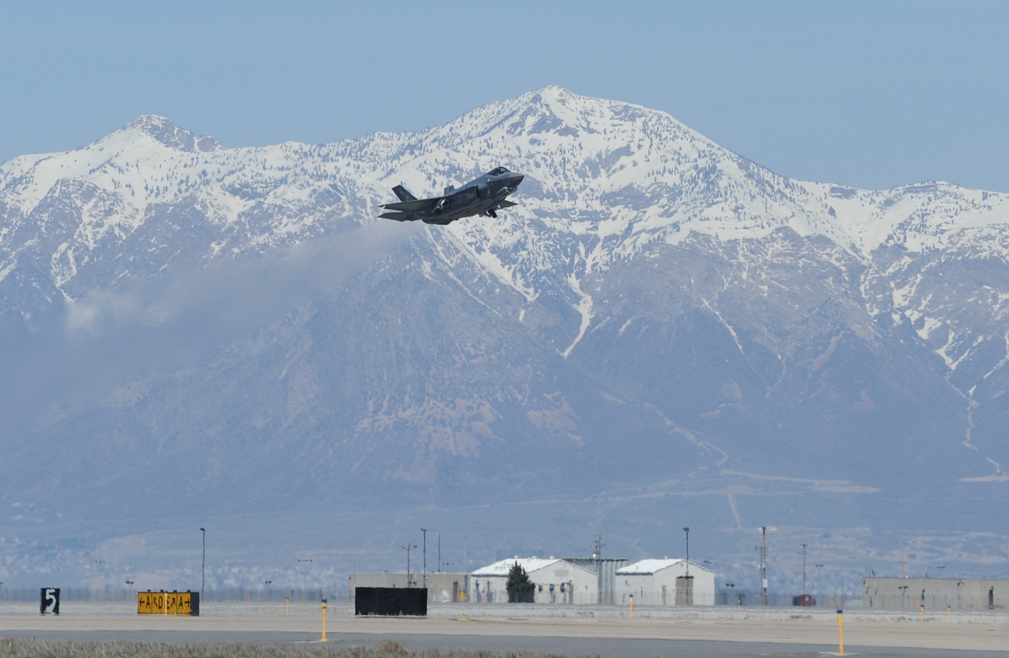 An F-35A Lightning II takes off March 25, 2014, from Hill Air Force Base, Utah en route to Nellis AFB, Nev. It was the first F-35 to receive organic modifications at the Ogden Air Logistics Complex at Hill AFB. The aircraft arrived at Hill AFB in September 2013 and received four structural modifications intended to strengthen areas of the aircraft and extends its service life. The Ogden ALC is expected to perform the series of modifications on a total of six F-35s during fiscal year 2014. Eight F-35s are expected to be inducted into the depot in fiscal year 2015. (U.S. Air Force photo/Alex R. Lloyd)