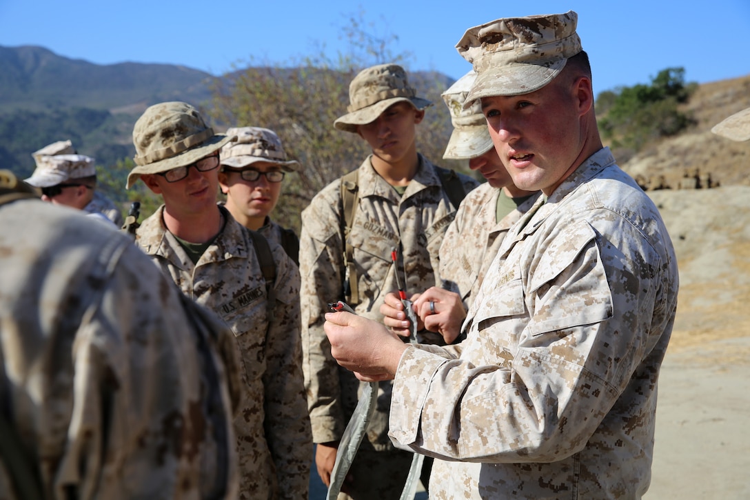 Sgt. Shane M. Cell, a combat instructor with Headquarters & Instructor Company, Infantry Training Battalion, School of Infantry -  West, teaches Marines how to construct a breaching charge as part of the ITB assaultman course, Sept. 22. Combat instructors work long hours every week to ensure each company of approximately 300 Marines are technically and tactically proficient before the end of either the 59-day ITB or 29-day Marine Combat Training curriculum. They teach new Marines infantry weapons systems and ground combat skills such as land navigation, military operations in urban terrain and the fundamentals of the combat hunter course.

(U.S. Marine Corps photo by Cpl. Shaltiel Dominguez)
