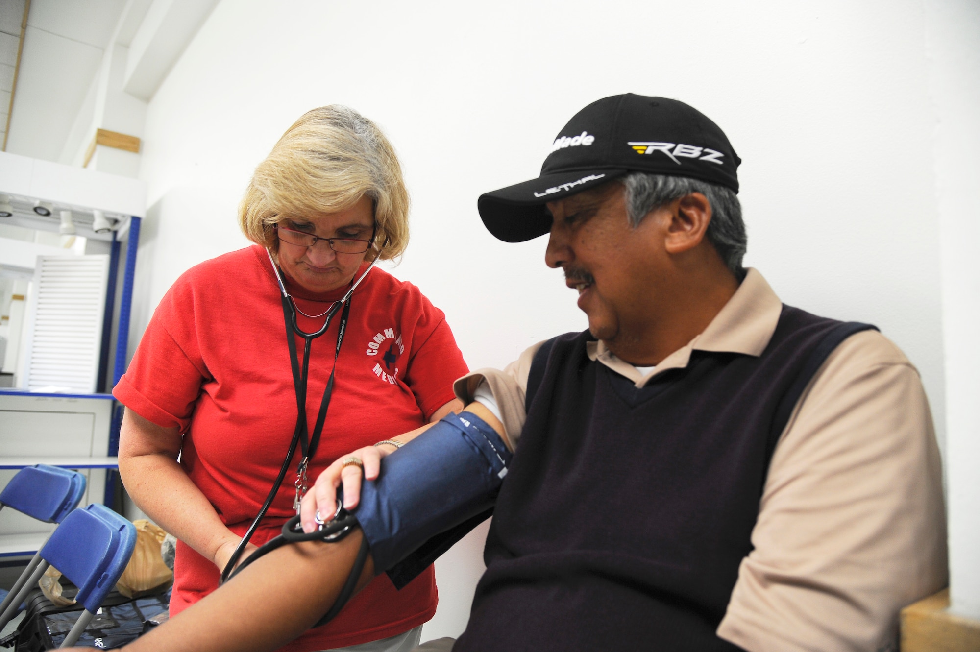 Martha Nobles, Certified Nursing Assistant, takes a patient’s blood pressure during Retiree Appreciation Day at the Base Exchange on Hurlburt Field, Fla., Sept. 25, 2014. The event offered participants free blood pressure checks and flu-shots. (U.S. Air Force photo/Staff Sgt. Sarah Hanson)