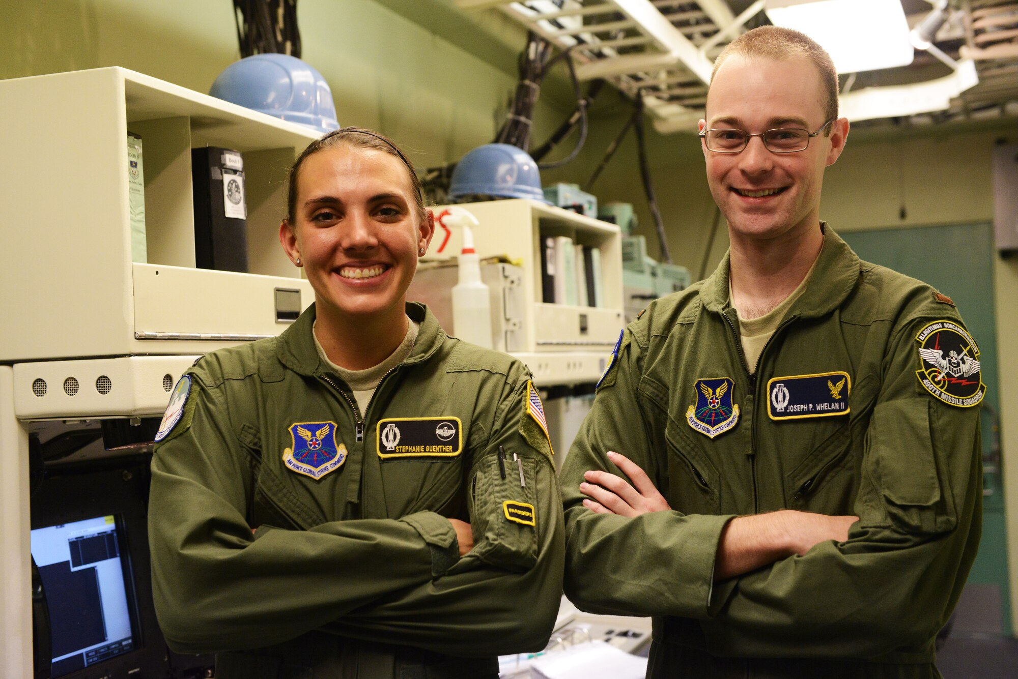1st Lt. Stephanie Guenther, 490th Missile Squadron combat missile crew commander (left), and 2nd Lt. Joseph Whelan, 490th MS deputy missile combat crew commander, pose for a photograph after a training session at Malmstrom Air Force Base Sept. 24. The team is one of nine from the base that will be competing in the 2014 Air Force Global Strike Challenge. (U.S. Air Force photo/Airman 1st Class Collin Schmidt)