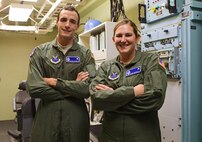 2nd Lt. Michael McCrary, 10th Missile Squadron deputy missile combat crew commander (left), and Capt. Katie Grimley, 10th MS combat missile crew commander, pose for a photograph after a training session in the missile procedures trainer at Malmstrom Air Force Base Sept. 24. The team is one of nine from the base that will be competing in the 2014 Air Force Global Strike Challenge. (U.S. Air Force photo/Airman 1st Class Collin Schmidt)