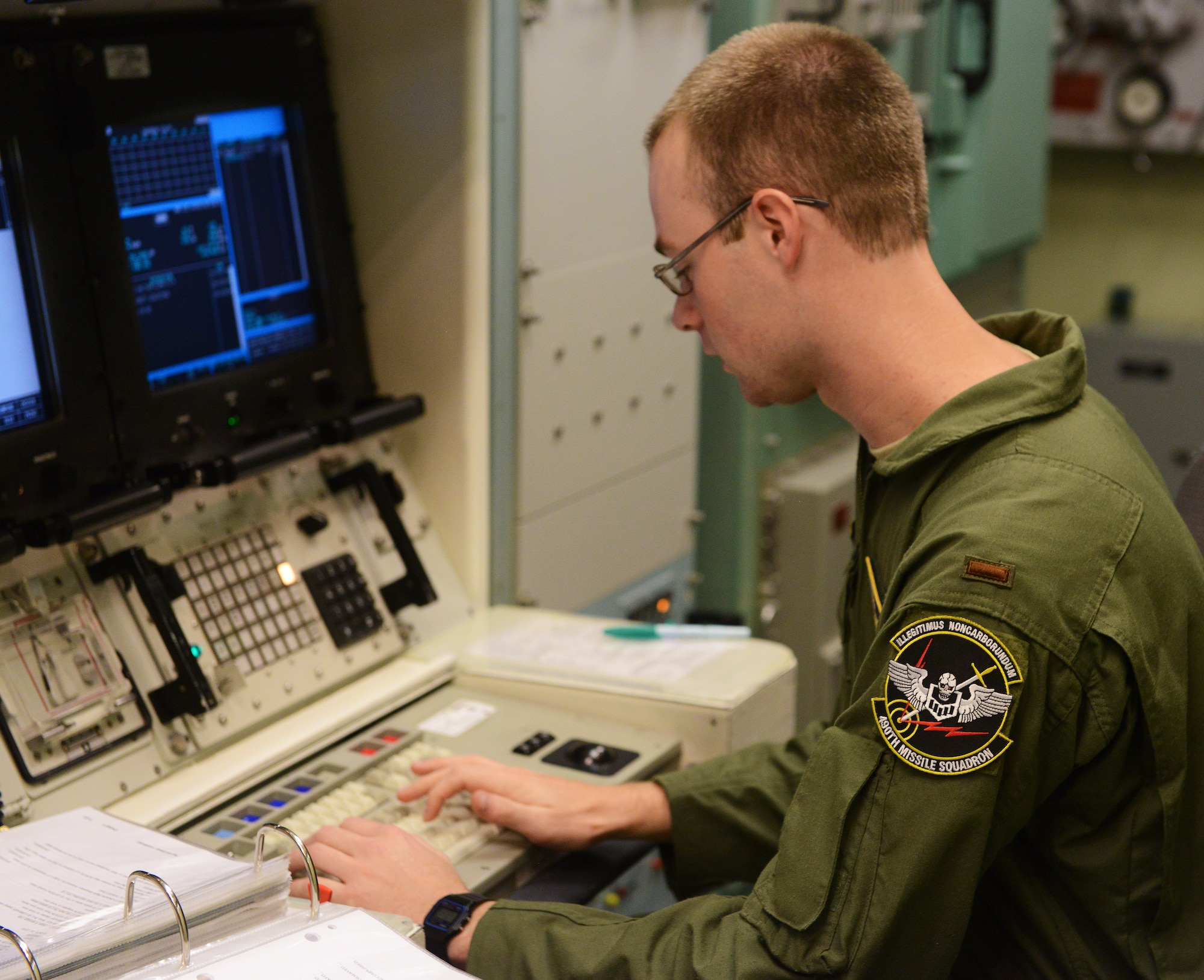 2nd Lt. Joseph Whelan, 490th Missile Squadron deputy missile combat crew commander, enters a simulated preparatory launch command in the missile procedures trainer during a training session at Malmstrom Air Force Base Sept. 24. The command information is used during key operations, and is a procedure the team could be tested on during the 2014 Global Strike Challenge. (U.S. Air Force photo/Airman 1st Class Collin Schmidt)