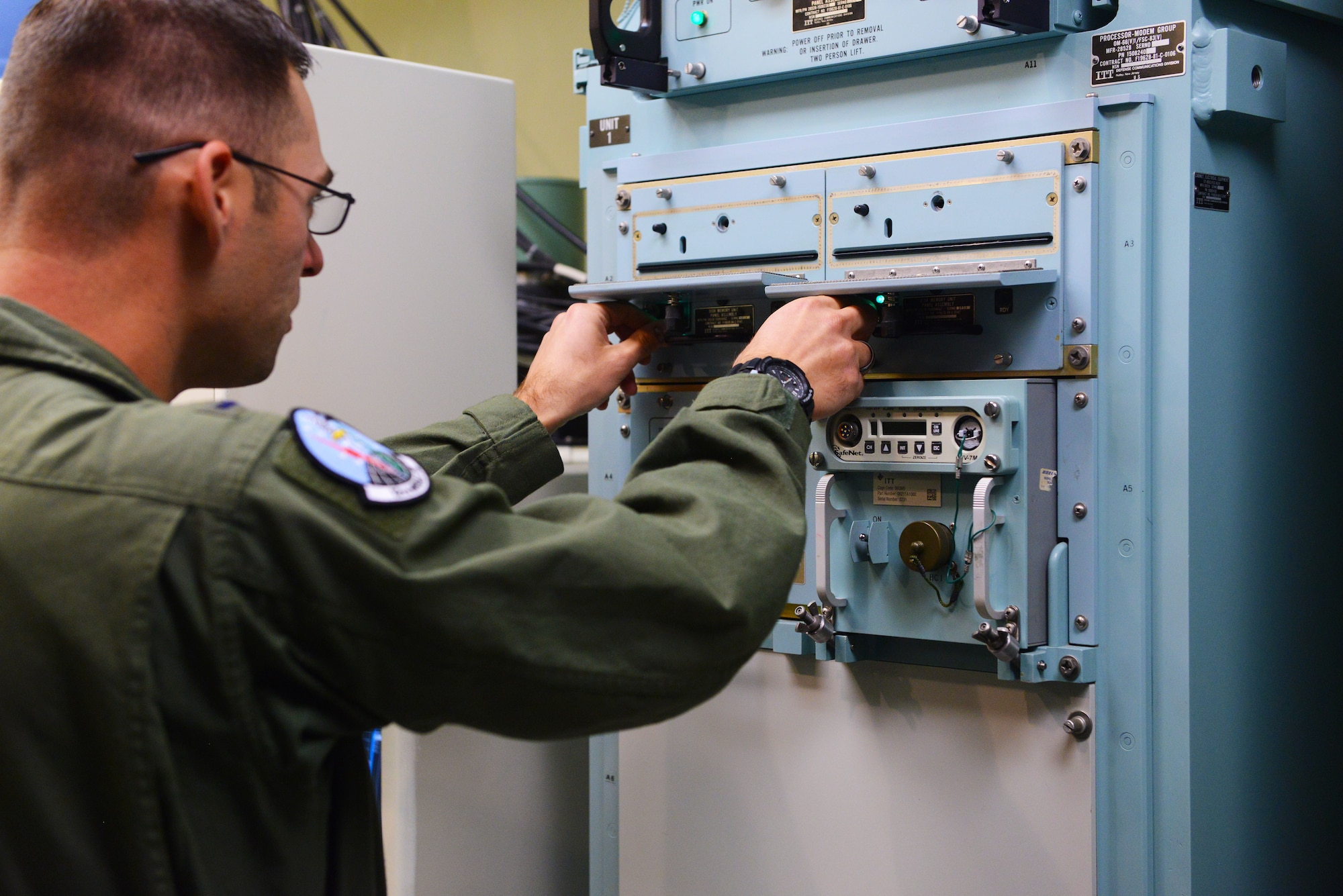 1st Lt. Jeff Cumber, 12th Missile Squadron deputy missile combat crew commander, accomplishes a strategic automated command and control system startup in the missile procedures trainer during a training session at Malmstrom Air Force Base Sept. 24. The system ensures communication between combat crews in the field and their counterparts, and could be a possible testing scenario during the 2014 Global Strike Challenge. (U.S. Air Force photo/Airman 1st Class Collin Schmidt)