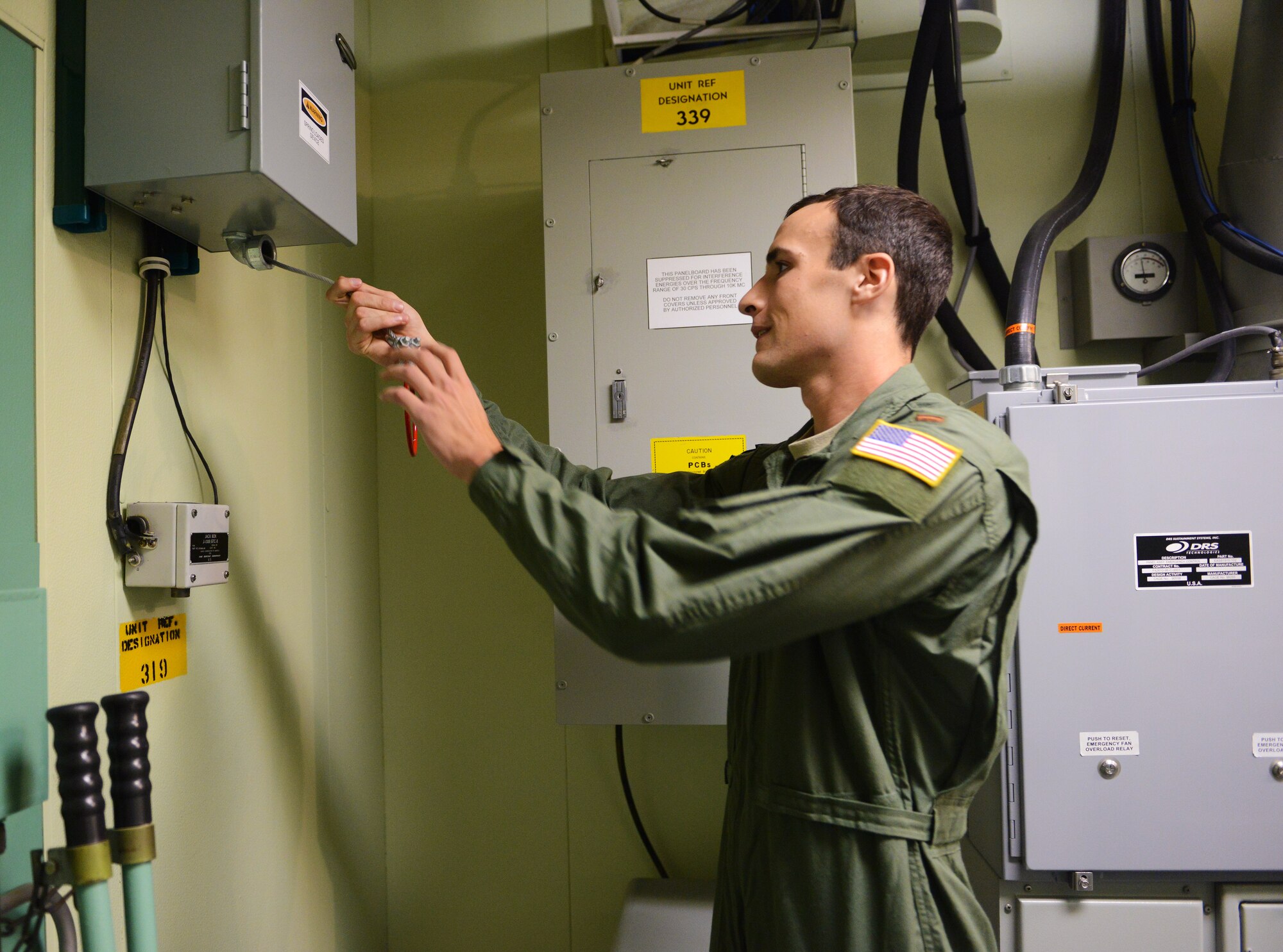 2nd Lt. Michael McCrary, 10th Missile Squadron deputy missile combat crew commander, closes an emergency shut off valve in the missile procedures trainer during a training session at Malmstrom Air Force Base Sept. 24. For the past month, missileers from the 10th, 12th and 490th missile squadrons have been constantly preparing for the 2014 Global strike Challenge. (U.S. Air Force photo/Airman 1st Class Collin Schmidt)