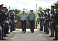 Gen. Hawk Carlisle, Pacific Air Forces commander (left), and Lt. Gen. Huang Guoxian (right), commander Nanjing Military Regional Air Force Command, render salutes while passing through an honor guard cordon, Sept. 23, 2014, Joint Base Pearl Harbor-Hickam, Hawaii.  Carlisle hosted Huang and a delegation of People's Liberation Army Air Force officers as part of a reciprocal visit key to building a strong military to military relationship between the U.S. and China. (U.S. Air Force photo by Tech. Sgt. James Stewart/Released)