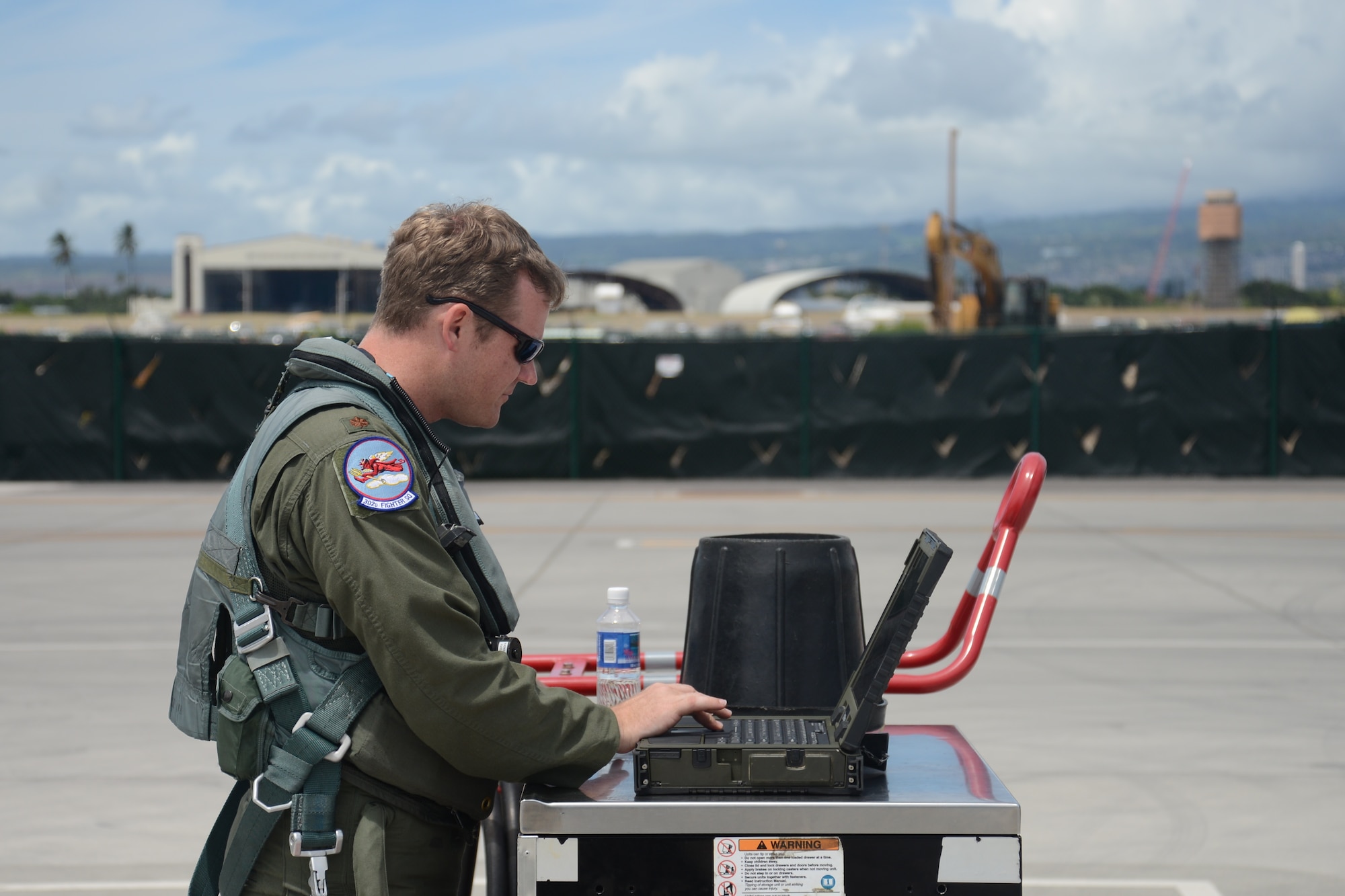 Maj. Ryan Pelkola,  Reserve F-22 pilot assigned to the 302nd Fighter Squadron, is the eighth pilot in Air Force history to reach 1,000 flight hours in the F-22 during a sortie here September 9. (U.S. Air Force photo/Tech. Sgt. Dana Rosso)
