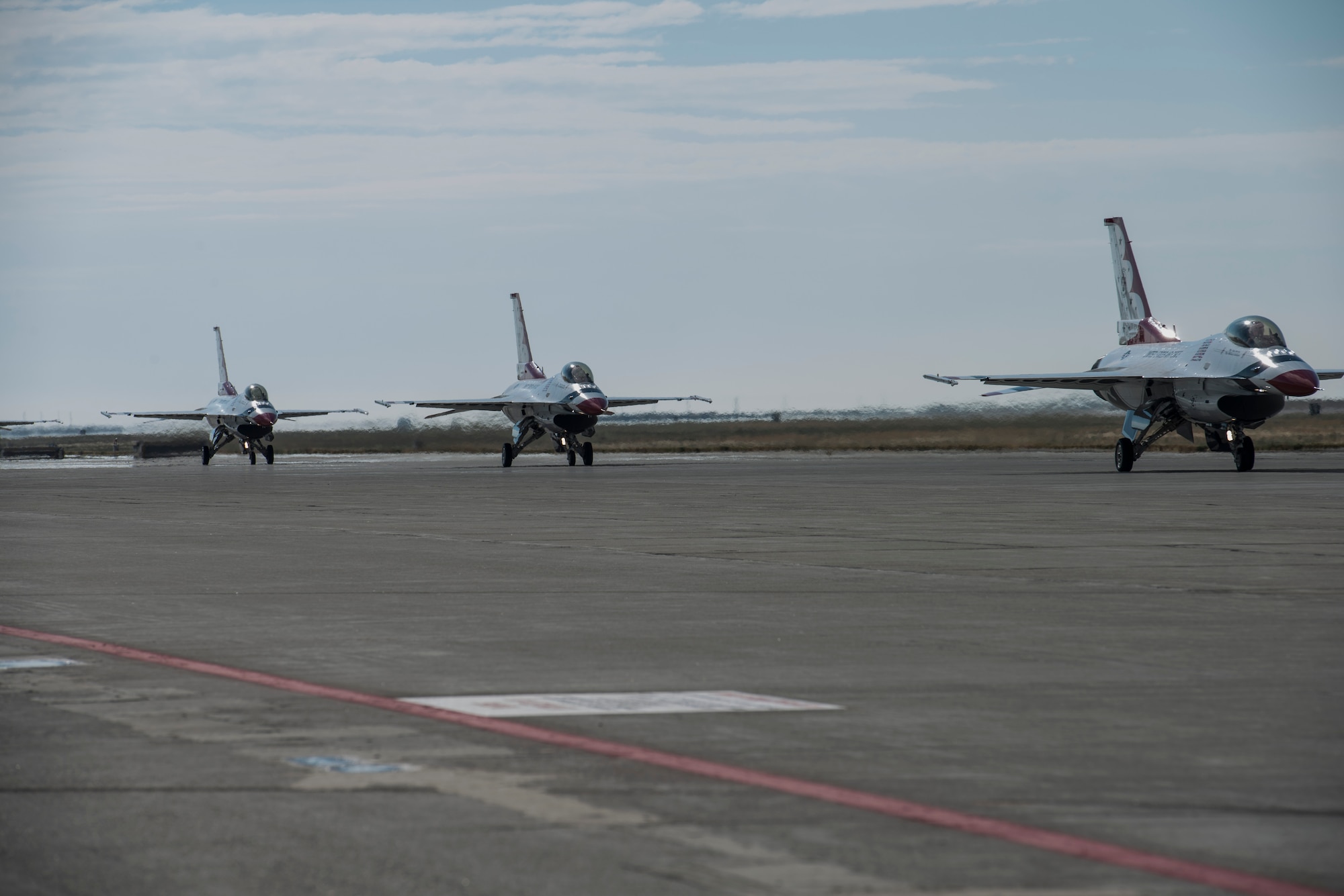 The USAF Thunderbirds taxi toward take-off at Mountain Home Air Force Base, Idaho, Sept. 22, 2014. Airmen from airfield management are responsible for scheduling all ariivals and departures of aircraft. (U.S. Air Force photo by Airman 1st Class Jessica Smith/RELEASED)