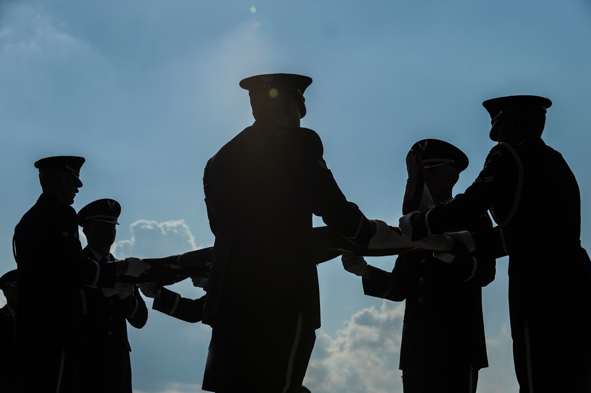 Members of the base honor guard fold the American Flag during the Prisoner of War/Missing in Action Recognition Day Retreat Ceremony Sept. 19, 2014, at Little Rock Air Force Base, Ark. More than 83,000 Americans remain missing from World War II, the Korean War, the Cold War, the Vietnam War and the 1991 Gulf War. (U.S. Air Force photo by Airman 1st Class Cliffton Dolezal)