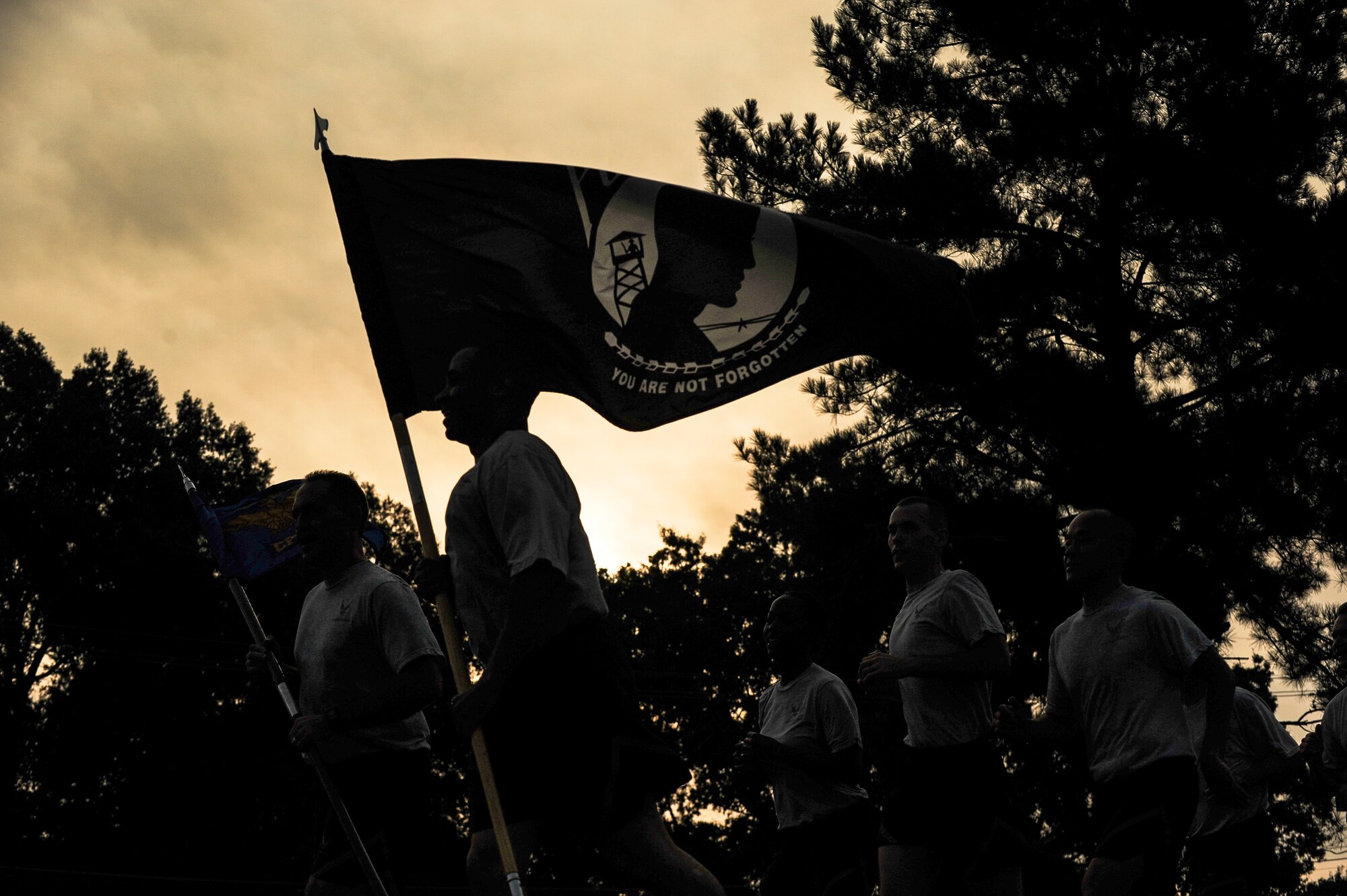 Airmen from the 19th Airlift Wing run during the Prisoner of War/Missing in Action Recognition Day run Sept. 19, 2014, at Little Rock Air Force Base, Ark. POW/MIA Recognition Day is traditionally recognized on the third Friday in September. It honors those who were prisoners of war and those who are still missing in action. (U.S. Air Force photo by Airman 1st Class Cliffton Dolezal)