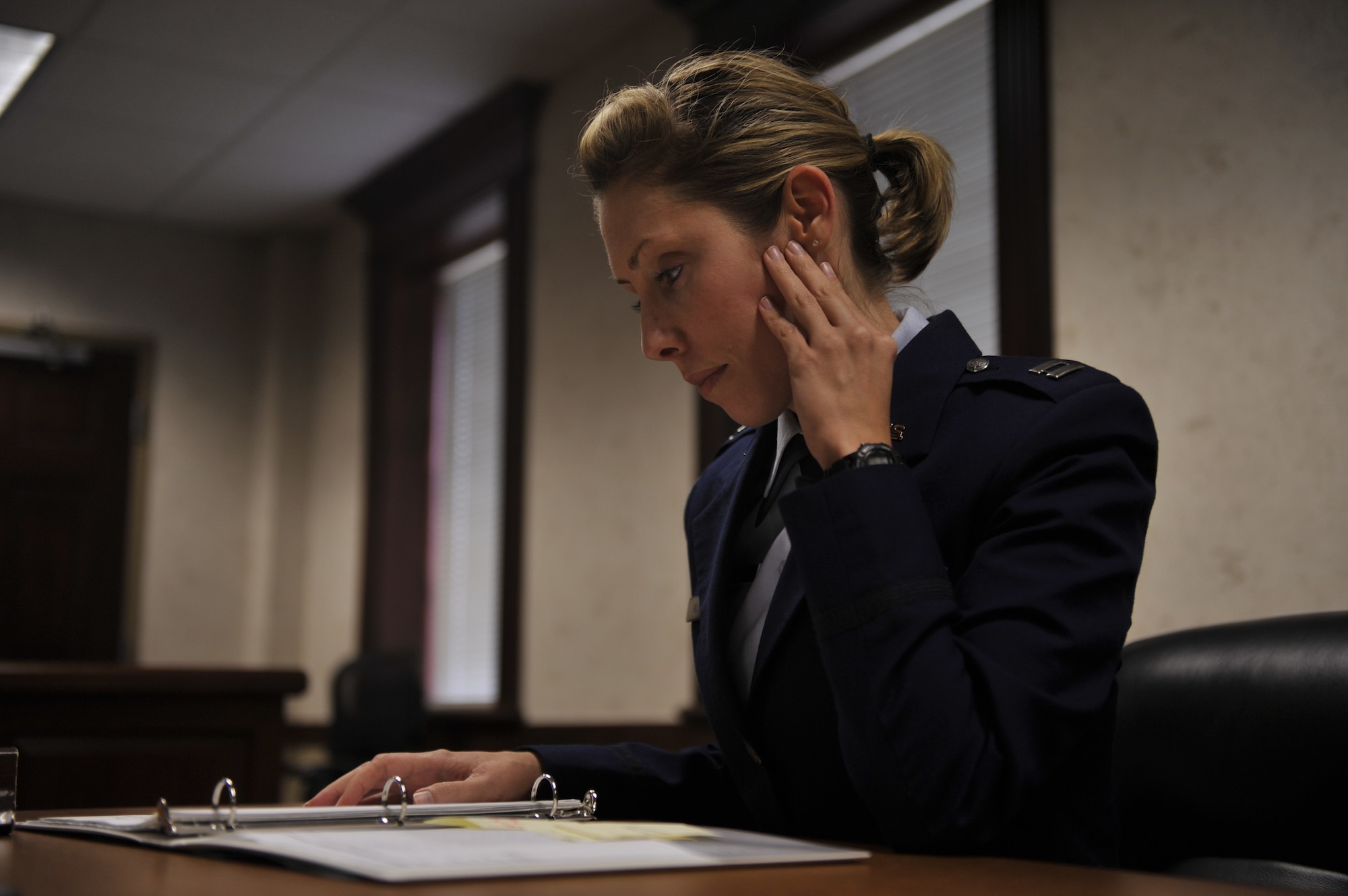 Capt. Melina Hill, 19th Airlift Wing Office of the Staff Judge Advocate assistant judge advocate, simulates preparing for a trial Sept. 19, 2014, at Little Rock Air Force Base, Ark. At times, attorneys may take months to prepare for one trial. (U.S. Air Force photo by Senior Airman Regina Agoha)