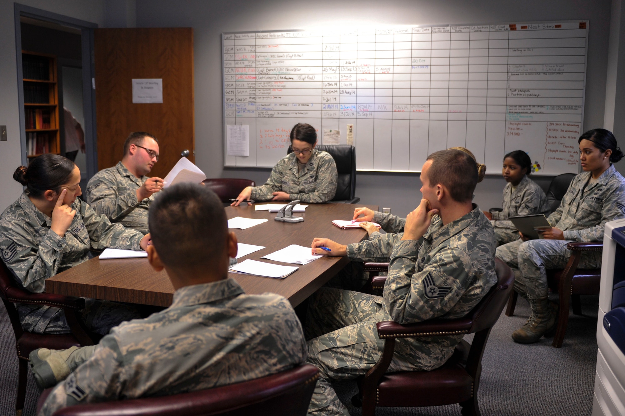 Capt. Michelle Gregory, 19th Airlift Wing Office of the Staff Judge Advocate chief of military justice, conducts the weekly military justice meeting Sept. 16, 2014, at Little Rock Air Force Base, Ark. This meeting is for all paralegals to discuss ongoing cases, courts-martial, Article 15s, and administrative discharges that are in process and other tasks for the week. (U.S. Air Force photo by Senior Airman Regina Agoha)