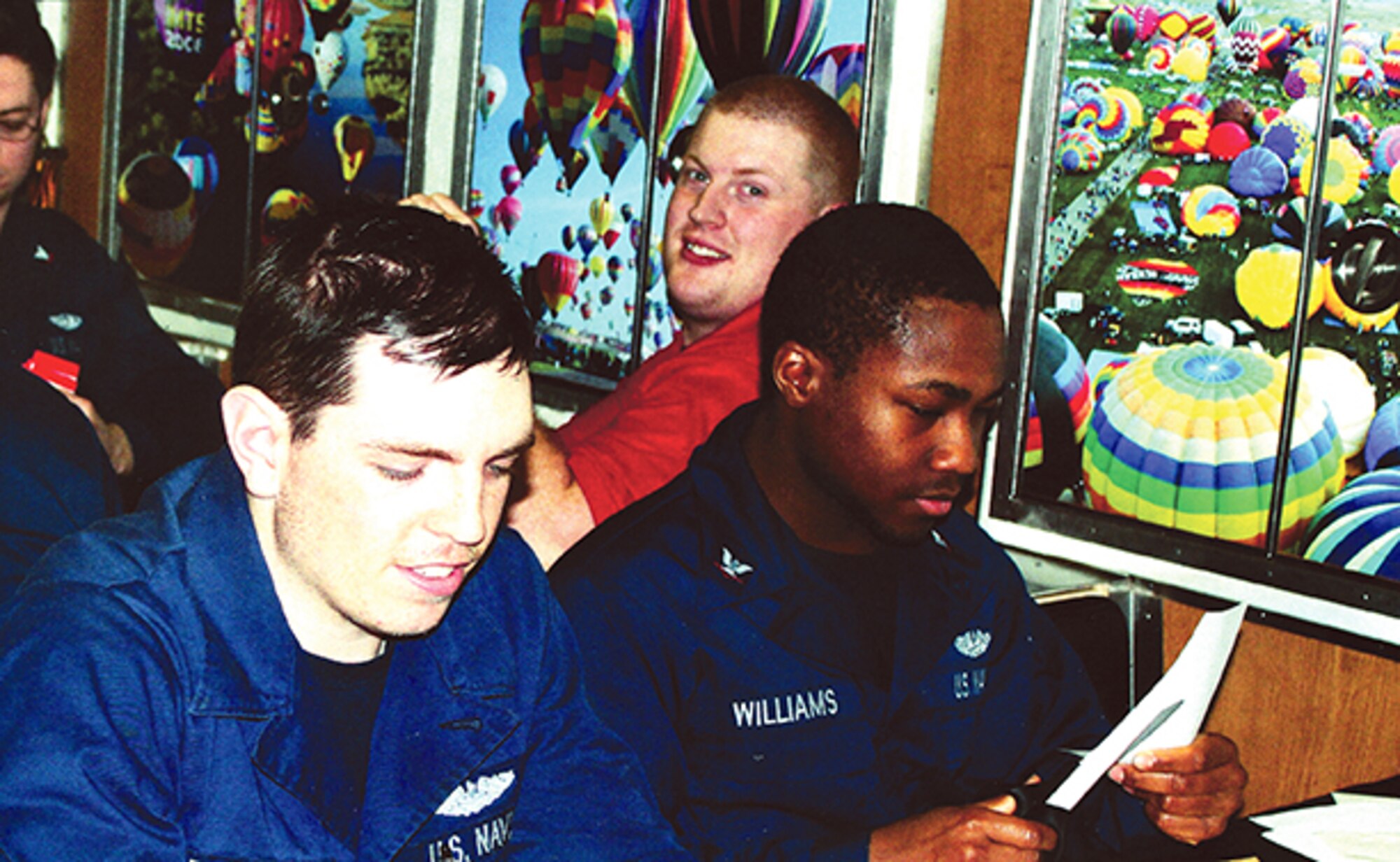 Sailors aboard the submarine USS New Mexico are in a mess hall filled with photos and from their vessel’s namesake state, which are provided by local members of the Navy League. The USS New Mexico is the first Navy vessel named after the state since the 1940s. (Courtesy photo)