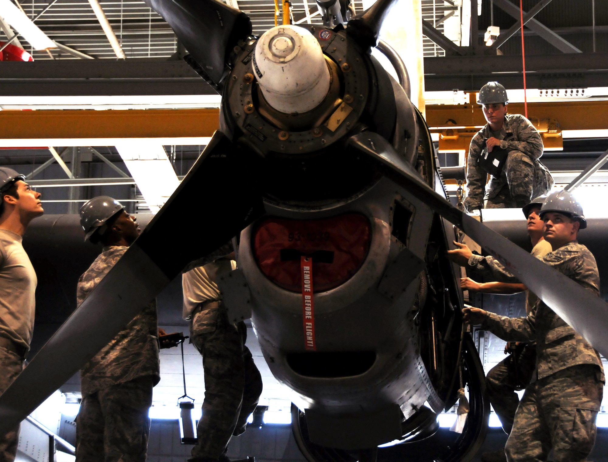 Airmen from the 94th Maintenance Squadron place an engine into the wing of a C-130 Hercules at Dobbins Air Reserve Base, Ga., Sept. 25, 2014. On Sept. 29, the 94th Airlift Wing is sending one C-130 and a team of 44 Airmen to partake in RED FLAG-Alaska 15-1. (U.S. Air Force photo by Senior Airman Daniel Phelps/Released)
