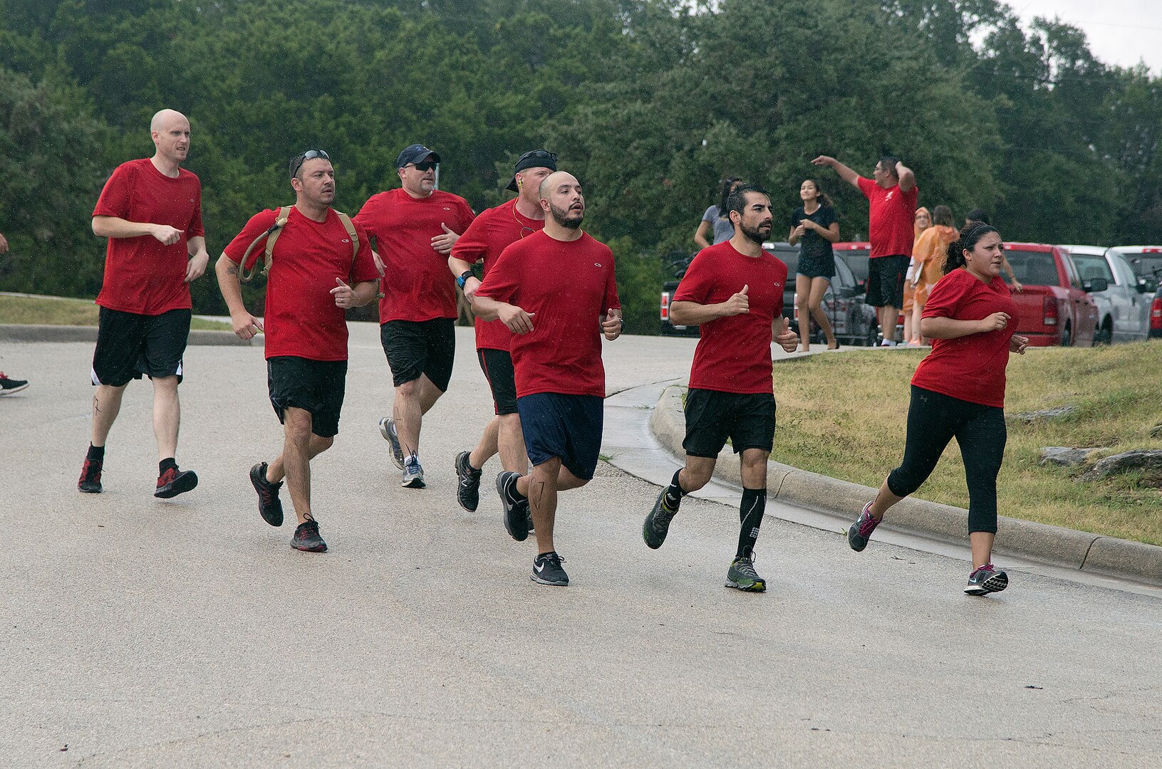 Rambler 120 participants run as a team toward the finish line during the mystery event portion of the annual Rambler 120 Competition Sept. 20 at Joint Base San Antonio Recreation Park at Canyon Lake. The Rambler 120, which is hosted by the 502nd Force Support Squadron, features four- and eight-person teams that engage in a friendly, but hard-fought, competition that challenges participants with a 22-mile bike race, 6-mile run, 2-mile raft race and a mystery event. (U.S. Air Force photo by Johnny Saldivar)