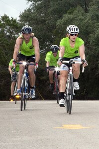 Ed Barnard, front left, Margaux Salas, front right, Todd Getz, rear left, and Jacob Minnick race down a hill of the 22-mile bike race portion of the annual Rambler 120 Competition Sept. 20 at Joint Base San Antonio Recreation Park at Canyon Lake. The Rambler 120, which is hosted by the 502nd Force Support Squadron, features four- and eight-person teams that engage in a friendly, but hard-fought, competition that challenges participants with a 22-mile bike race, 6-mile run, 2-mile raft race and a mystery event. Barnard, Salas, Getz, and Minnick are members of the U.S. Army Institute of Surgical Research-Air Force En route Care Research Center at JBSA-Fort Sam Houston. (U.S. Air Force photo by Johnny Saldivar)

