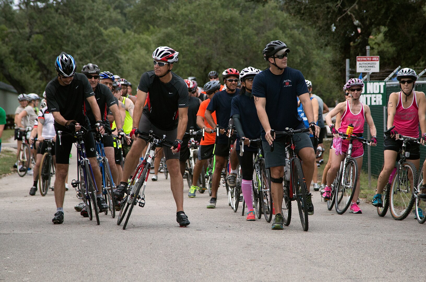 Rambler 120 participants await the start of the 22-mile bike race portion of the annual Rambler 120 Competition Sept. 20 at Joint Base San Antonio Recreation Park at Canyon Lake. The Rambler 120, which is hosted by the 502nd Force Support Squadron, features four- and eight-person teams that engage in a friendly, but hard-fought, competition that challenges participants with a 22-mile bike race, 6-mile run, 2-mile raft race and a mystery event. (U.S. Air Force photo by Johnny Saldivar)

