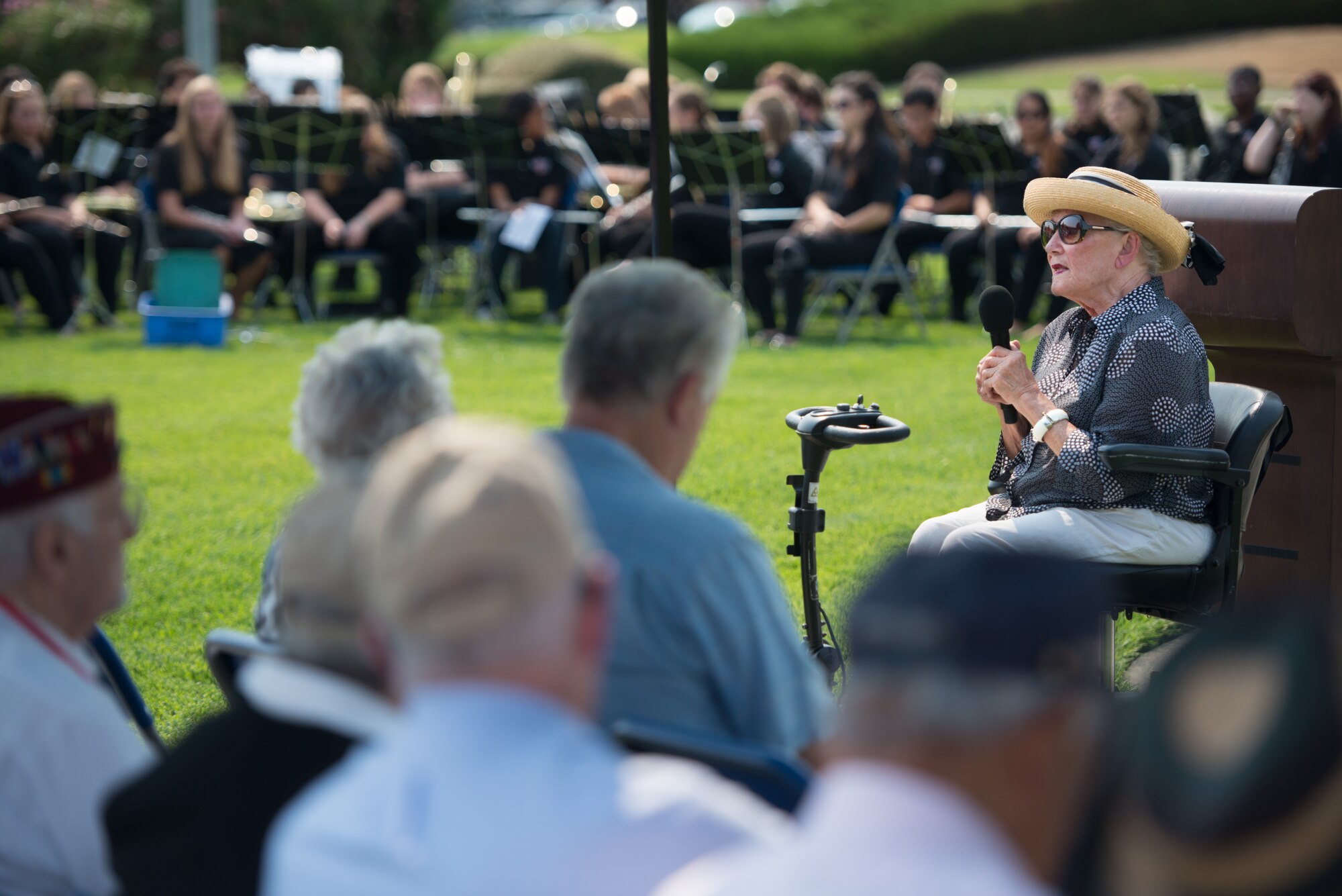 Sascha Jean Jansen,  who as a child was a prisoner of war in the Philippines during World War II, speaks to Airmen and honored guests at Travis Air Force Base during a POW/MIA remembrance ceremony Sept. 19, Jansen recalled years of imprisonment by her Japanese captors, and the joy she and other prisoners felt as they looked to the sky to witness American Airmen obliterating enemy fighters. She also called upon all Airmen to never forget the importance of their uniform and how it serves as a beacon of hope for those who look to them for help and the preservation of freedom. (U.S. Air Force photo/Ken Wright).