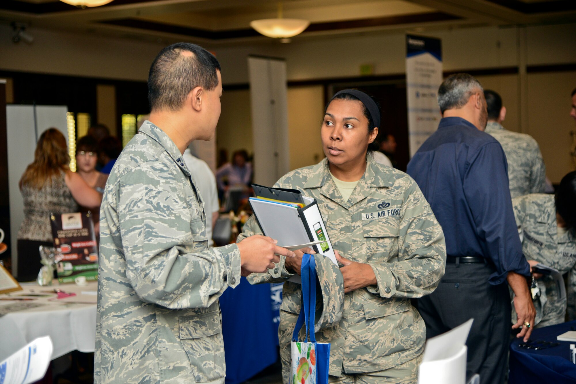 Master Sgt. Lucita Wargel, 60th Civil Engineer Squadron, interacts with recruiters and counselors at the Employment and Education Fair Sept. 23 at the Delta Breeze Club on Travis Air Force Base. (U.S. Air Force photo/Senior Airman Madelyn Brown)