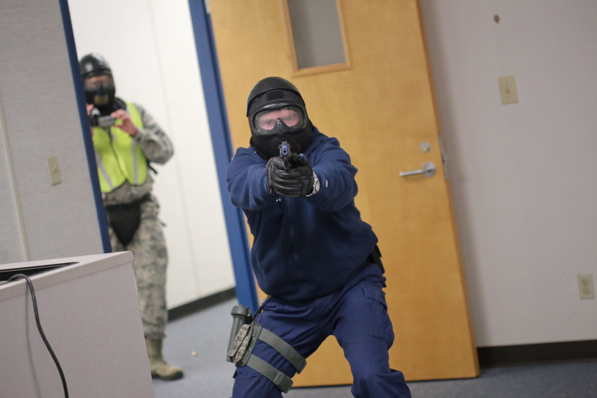 A picture of U.S. Coast Guard Petty Officer 1st Class Seth Tucker clearing a room during active shooter training.