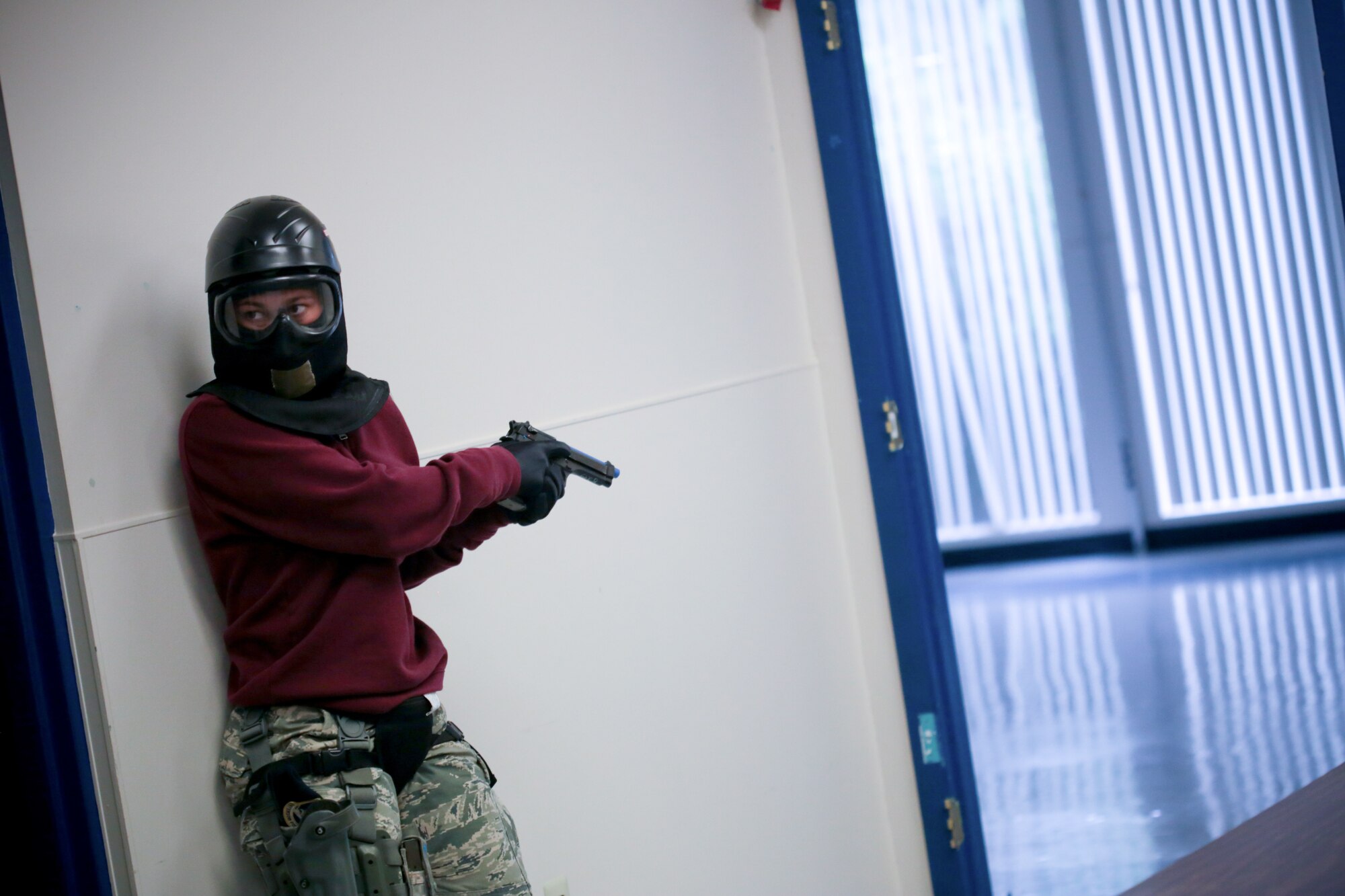 A picture of U.S. Air Force Staff Sgt. Stardust Santiago from New Jersey Air National Guard's 177th Security Forces Squadron providing rear security for an entry team.