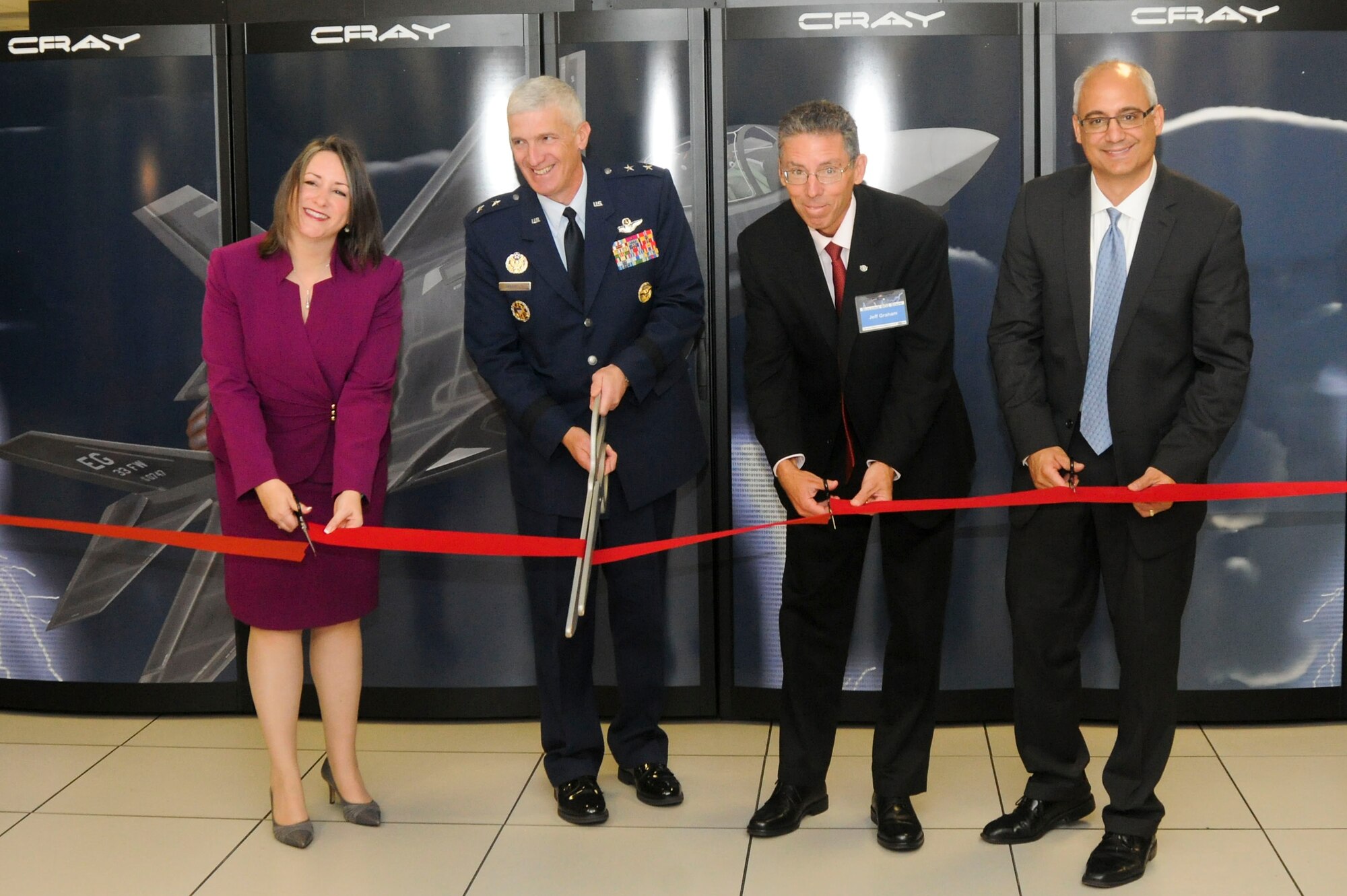 From left: Ms. Christine Cuicchi, Associate Director for DoD High Performance Computing Centers, AFRL commander Maj. Gen. Thomas Masiello, Mr. Jeff Graham, Chief of Air Force Research Laboratory's DoD Supercomputing Resource Center, and Mr. Peter Ungaro, CEO Cray Inc. cut the ribbon in a ceremony unveiling the new Lightning supercomputer. (U.S. Air Force photo by Wesley Farnsworth)