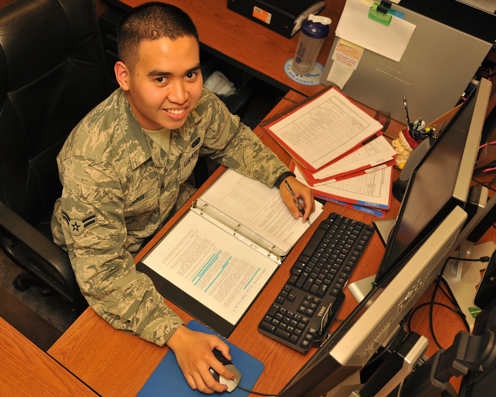Airman 1st Class Jeconiah Jamir, 319th Logistics Readiness Squadron equipment accountability apprentice, researches regulations on material and supply management Sept. 24, 2014, on Grand Forks Air Force Base, N.D. Jamir was selected as the base's Warrior of the Week for the fourth week in September. (U.S. Air Force photo/Senior Airman Xavier Navarro)
