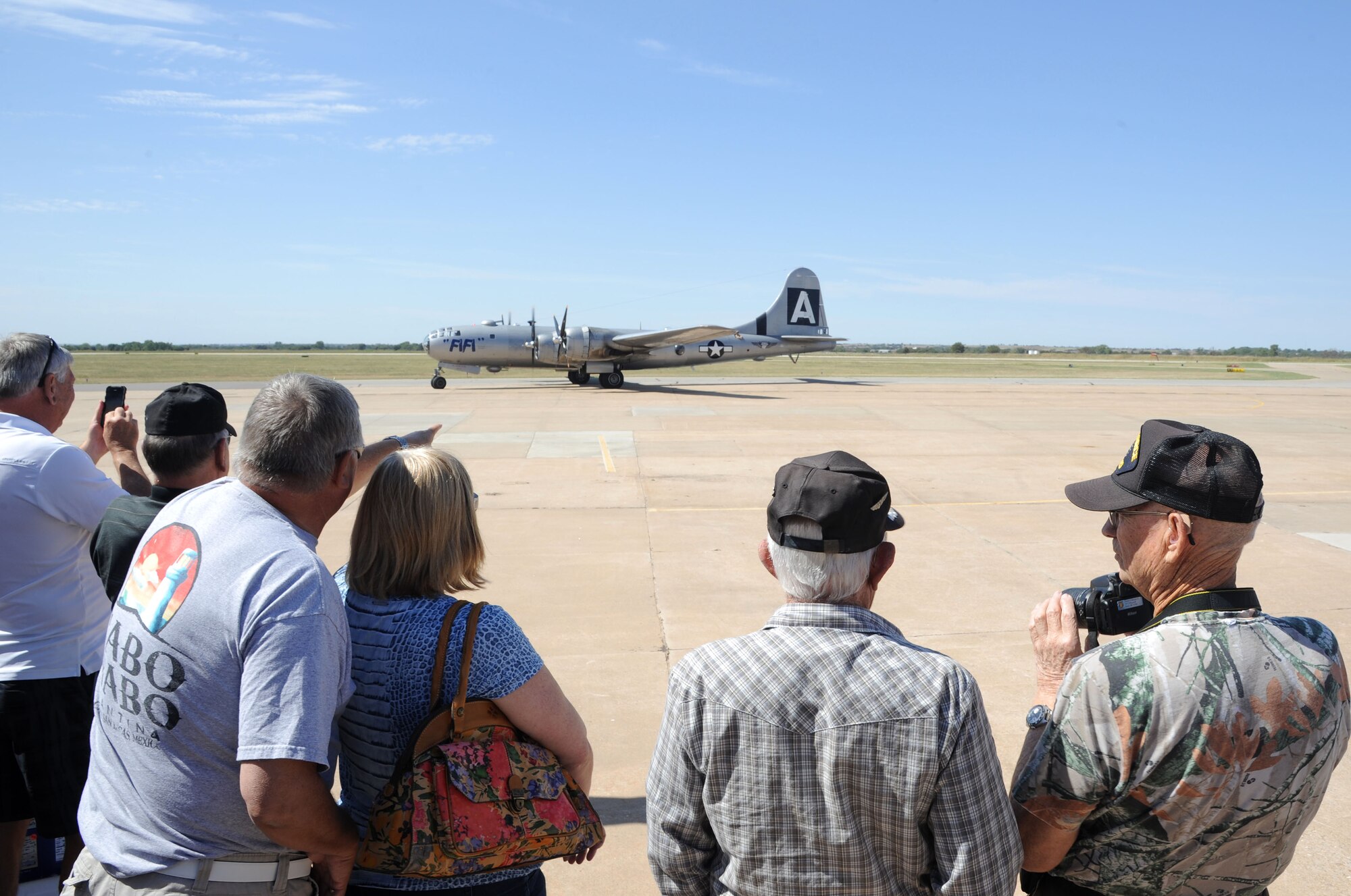 Members of the Enid community watch a B-29 Superfortress taxi at Woodring Regional Airport, Enid, Oklahoma, Sept. 22. The B-29 known as “Fifi” is the only operational B-29 in the world and is used to educate people about the history of the B-29s as it flies around the U.S.   (U.S. Air Force photo/Staff Sgt. Nancy Falcon)
