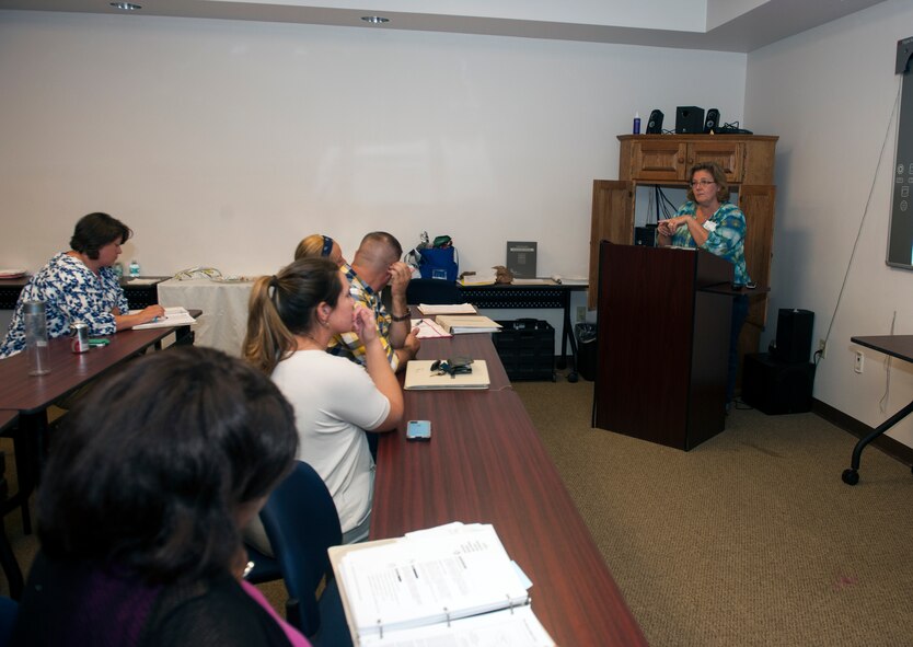 Evelyn Fox, far right, Court Appointed Special Advocate (CASA) Association advocacy coordinator, answers questions at the end of a training session Sept. 19, 2014, at Moody Air Force Base, Ga. Six volunteers from Moody participated in the training, which will also include court observations and workbook exercises. (U.S. Air Force photo by Senior Airman Jarrod Grammel/Released)