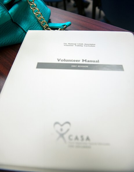 A court appointed special advocate (CASA) volunteer manual sits on a desk during CASA training Sept. 19, 2014, at Moody Air Force Base, Ga. The CASA training, which is typically held at the local CASA office, was brought to Moody in an effort to make it more accessible to military members and their families. (U.S. Air Force photo by Senior Airman Jarrod Grammel/Released)
