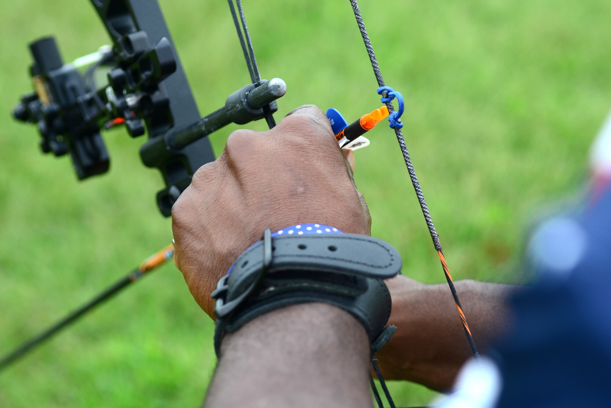 Former U.S. Air National Guard Senior Airman Dwayne Parker slings an arrow at Langley Air Force Base, Va., Sep. 23, 2014. Parker trains as a back-up competitor for the Warrior Games, an annual sports competition for wounded, ill and injured veterans. (U.S. Air Force photo by Airman 1st Class Devin Scott Michaels) 