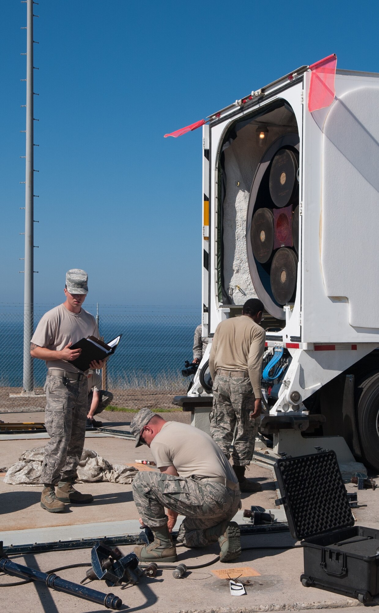 Missile maintenance Airmen prepare to unload a Minuteman III ICBM from a transport vehicle at the Vandenberg Air Force Base, Calif., Aug. 26, 2014. A joint team from the 576th Test Squadron at Vandenberg and the 91st Missile Squadron at Minot AFB, N.D., launched the missile Sept. 23, showcasing the capabilities of the Air Force’s ground-based leg of the nation’s nuclear triad. (U.S. Air Force courtesy photo)