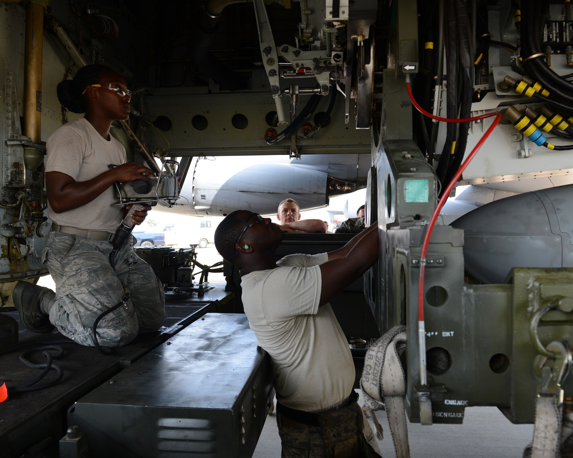 Weapons Loaders Senior Airman Breyana Anderson and Staff Sgt. Raymond Edgerson, position an unarmed AGM-86B Air-Launched Cruise Missile for loading into the bomb bay of a B-52H Stratofortress at Barksdale Air Force Base, Louisiana, Sept. 17, 2014. The weapon was flown and released Sept. 22 as part of the Nuclear Weapons System Evaluation Program – an end-to-end operational evaluation of 8th Air Force and Task Force 204’s ability to deliver an ALCM from storage to its final target. (Photo by Senior Airman Benjamin Gonsier)