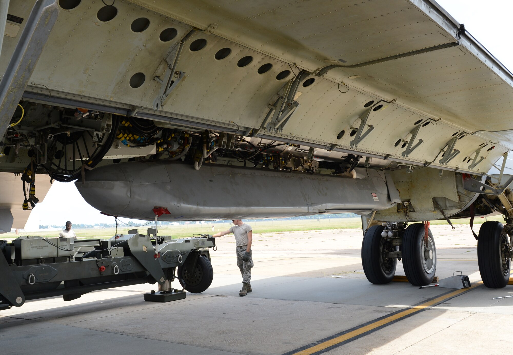 Weapons loaders assigned to the 2nd Bomb Wing, Barksdale Air Force Base, Louisiana, load an unarmed AGM-86B Air-Launched Cruise Missile aboard a B-52H Stratofortress in prior to a Sept. 22, 2014 Nuclear Weapons System Evaluation Program simulated combat mission. The loading was part of an end-to-end operational evaluation of 8th Air Force and Task Force 204’s ability to deliver the weapon from storage to its final target. (Photo by Senior Airman Benjamin Gonsier)