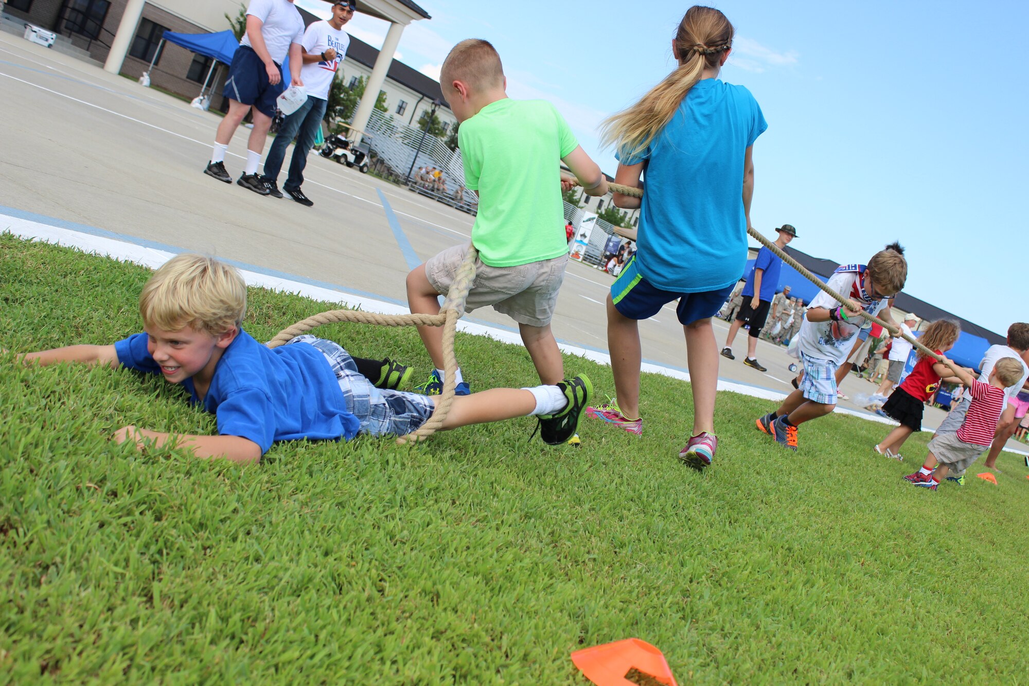 The son of Lt. Col. James Coughlin, 85th Engineering Installation Squadron commander, serves as the anchor for his team in a game of tug-of-war during the Air Force’s 67th birthday celebration Sept. 19, 2014, Keesler Air Force Base, Miss. The event also included a cake cutting ceremony, music, games, contests and food. (Courtesy photo by Natalie White)
