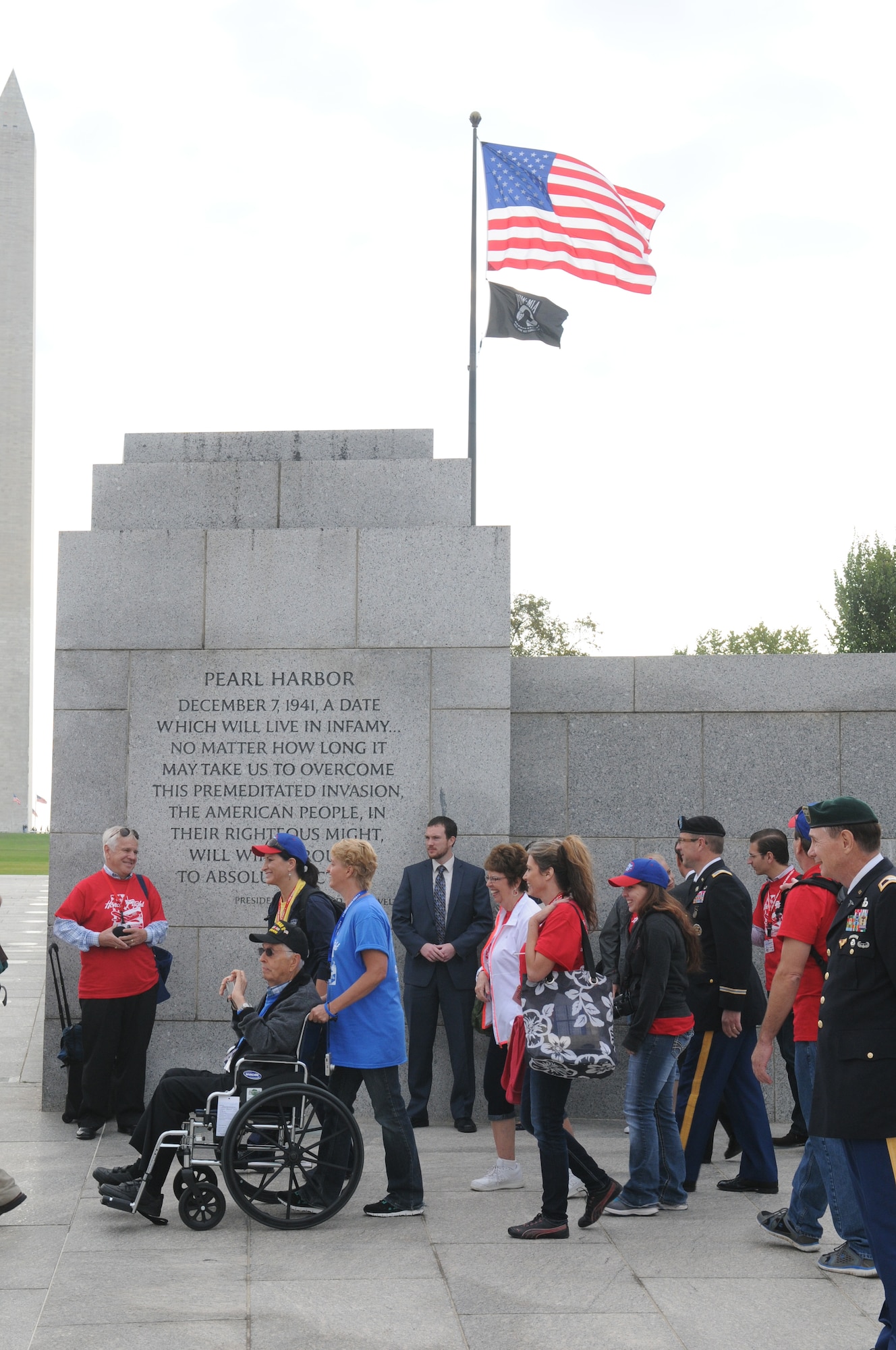 Art Young, a sergeant in the Army Air Corps during World War II, is escorted into the World War II Memorial in Washington, DC, Sept. 19, 2014. Young was escorted by his daughter Kristi, and was part of a group that consisted of 66 veterans that made the journey from Utah to see their memorial, many for the first time.(U.S. Air Force photo by Senior Master Sgt. Gary J. Rihn/Released)