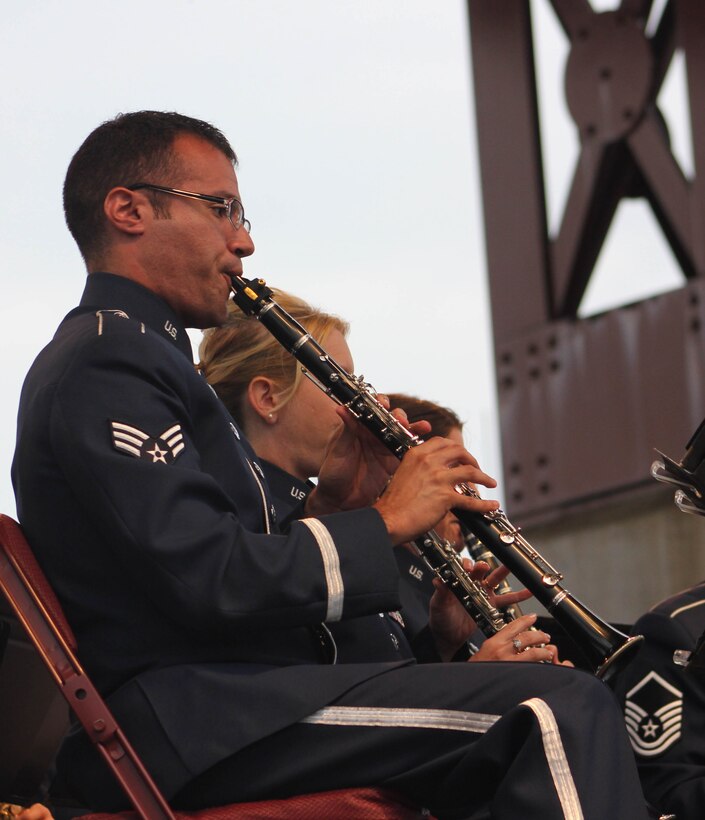 U.S. Air Force Senior Airman Jose E. Silva, instrumentalist with the 566th Air Force Band, performs during the Air National Guard Band of the Midwest's annual training at the Bayfront Festival Park, Duluth, Minn., July 4, 2014. They performed jazz, rock and concert music for audiences in Illinois and Wisconsin as part of their community relations tour before a grand finale in Minnesota July 4. The annual concert series was the result of a year’s worth of training and practice, one that the band used to celebrate patriotism with communities across the Midwest. (Courtesy photo/Released)