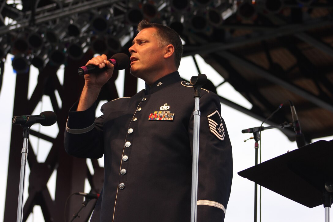 U.S. Air Force Master Sgt. Douglas A. Mattsey, instrumentalist with the 566th Air Force Band, performs during the Air National Guard Band of the Midwest's annual training at the Bayfront Festival Park, Duluth, Minn., July 4, 2014. They performed jazz, rock and concert music for audiences in Illinois and Wisconsin as part of their community relations tour before a grand finale in Minnesota July 4. The annual concert series was the result of a year’s worth of training and practice, one that the band used to celebrate patriotism with communities across the Midwest. (Courtesy photo/Released)