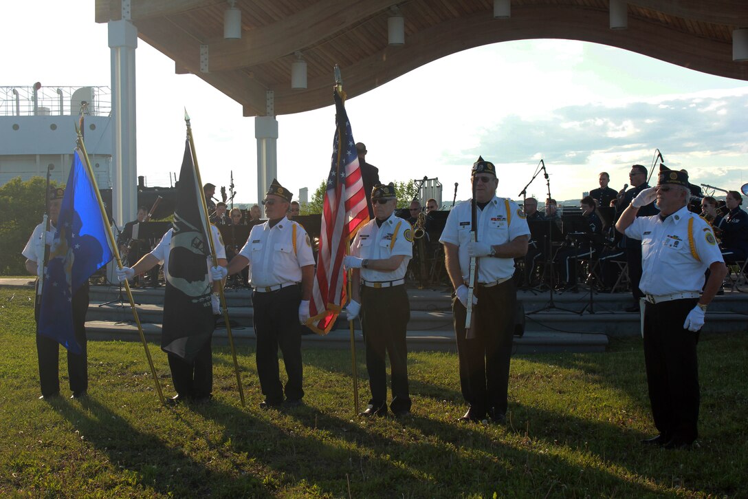 The colors are posted as instrumentalists with the Air National Guard Band of the Midwest perform for audiences during annual training at Barker’s Island Festival Park, Superior, Wis., July 3, 2014. They performed jazz, rock and concert music for audiences in Illinois and Wisconsin as part of their community relations tour before a grand finale in Minnesota July 4. The annual concert series was the result of a year’s worth of training and practice, one that the band used to celebrate patriotism with communities across the Midwest. (Courtesy photo/Released)