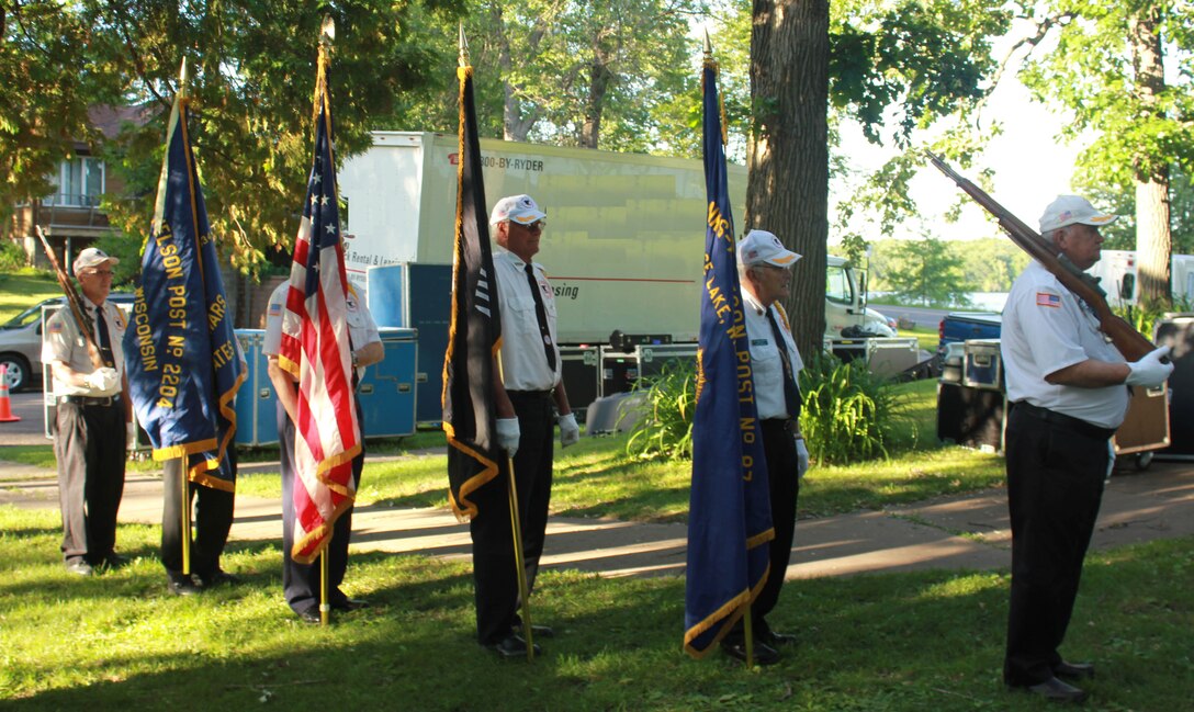 The colors are posted during the Air National Guard Band of the Midwest's annual training at the City Park Band Shell, Rice Lake, Wis., July 2, 2014. The band performed jazz, rock and concert music for audiences in Illinois and Wisconsin as part of their community relations tour before a grand finale in Minnesota July 4. The annual concert series was the result of a year’s worth of training and practice, one that the band used to celebrate patriotism with communities across the Midwest. (Courtesy photo/Released)