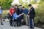 A World War II veteran is greeted by a military reciving party at the World War II Memorial in Washington, D.C., Sept. 19, 2014. The veteran was part of a group of 66 that were there to see their memorial, many for the first time.(U.S. Air Force photo by Senior Master Sgt. Gary J. Rihn/Released)