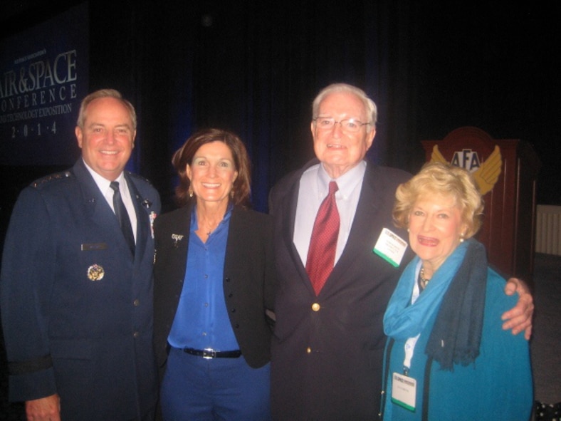 Air Force Chief of Staff Gen. Mark A. Welsh III and his wife, Betty, pose for a photo with Parker Greene and his wife, Lucy, during the Air Force Association's Air & Space Conference and Technology Exposition Sept. 16, 2014. During the event, Welsh recognized Greene for his dedication to the Airmen and mission of Moody Air Force Base, Ga. (Courtesy photo)
