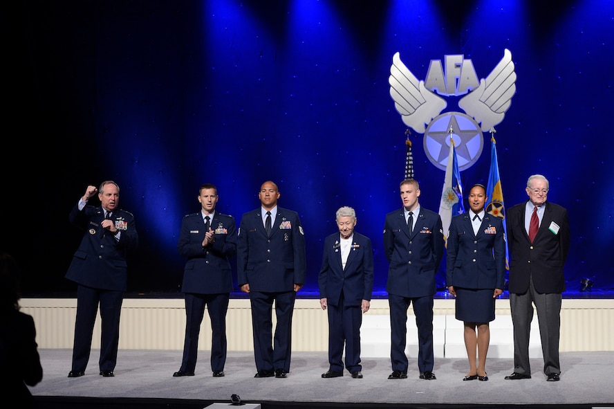 Air Force Chief of Staff Gen. Mark A. Welsh III recognizes longstanding Moody Air Force Base supporter Parker Greene (far right) during the Air Force Association's Air & Space Conference and Technology Exposition Sept. 16, 2014. Welsh commended Greene's dedication to the Airmen and mission of Team Moody and the Air Force. (U.S. Air Force Photo by Scott M. Ash/released)