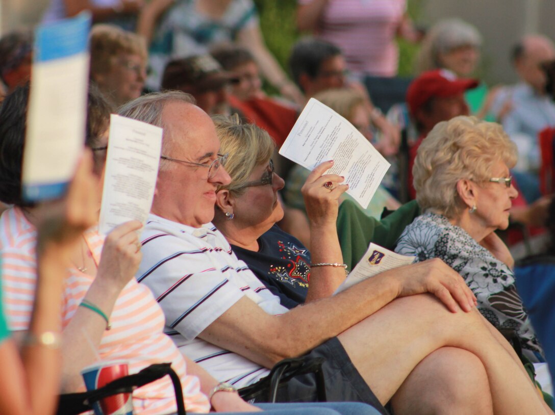 Audience members watch as the Air National Guard Band of the Midwest performs during annual training at the Grundy County Courtyard Lawn, Morris, Ill., June 29, 2014. They performed jazz, rock and concert music for audiences in Illinois and Wisconsin as part of their community relations tour before a grand finale in Minnesota July 4. The annual concert series was the result of a year’s worth of training and practice, one that the band used to celebrate patriotism with communities across the Midwest. (Courtesy photo/Released)