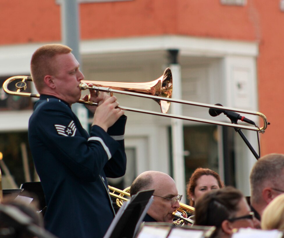 U.S. Air Force Staff Sgt. Kurt A. Dieringer, instrumentalist with the 566th Air Force Band, performs with the Air National Guard Band of the Midwest during annual training at the Grundy County Courtyard Lawn, Morris, Ill., June 29, 2014. They performed jazz, rock and concert music for audiences in Illinois and Wisconsin as part of their community relations tour before a grand finale in Minnesota July 4. The annual concert series was the result of a year’s worth of training and practice, one that the band used to celebrate patriotism with communities across the Midwest. (Courtesy photo/Released)