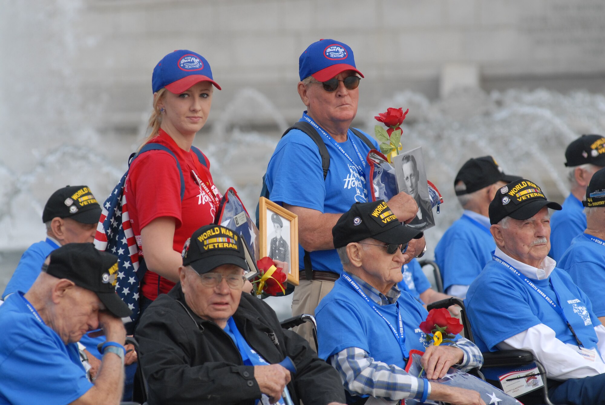 World War II veterans gather for a group photo at the World War II Memorial in Washington, D.C., Sept. 19, 2014. Family members standing amongst veterans also held portraits of recently passed veterans. The veterans were part of a group of 66 that were there to see their memorial, many for the first time.(U.S. Air Force photo by Senior Master Sgt. Gary J. Rihn/Released)