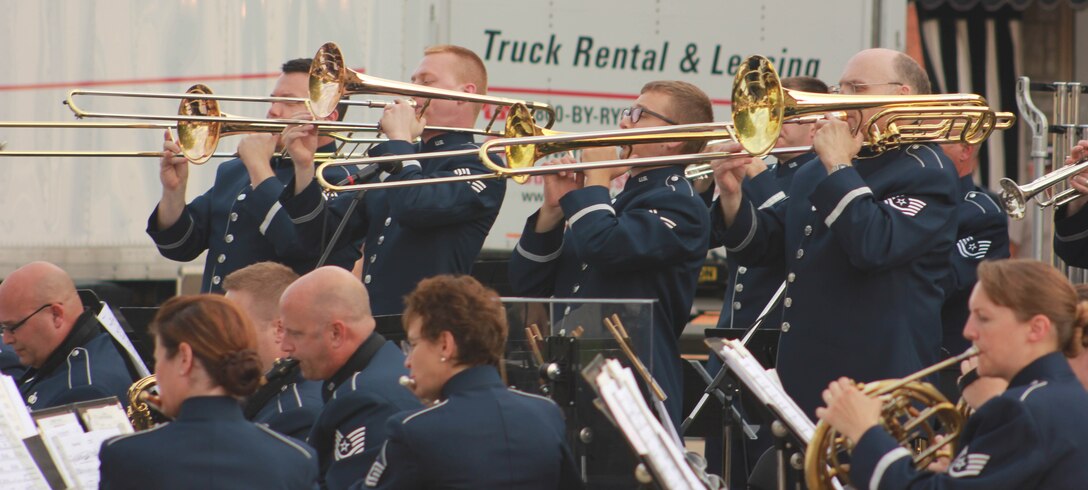 Instrumentalists with the Air National Guard Band of the Midwest perform for audiences during annual training at the Grundy County Courtyard Lawn, Morris, Ill., June 29, 2014. They performed jazz, rock and concert music for audiences in Illinois and Wisconsin as part of their community relations tour before a grand finale in Minnesota July 4. The annual concert series was the result of a year’s worth of training and practice, one that the band used to celebrate patriotism with communities across the Midwest. (Courtesy photo/Released)